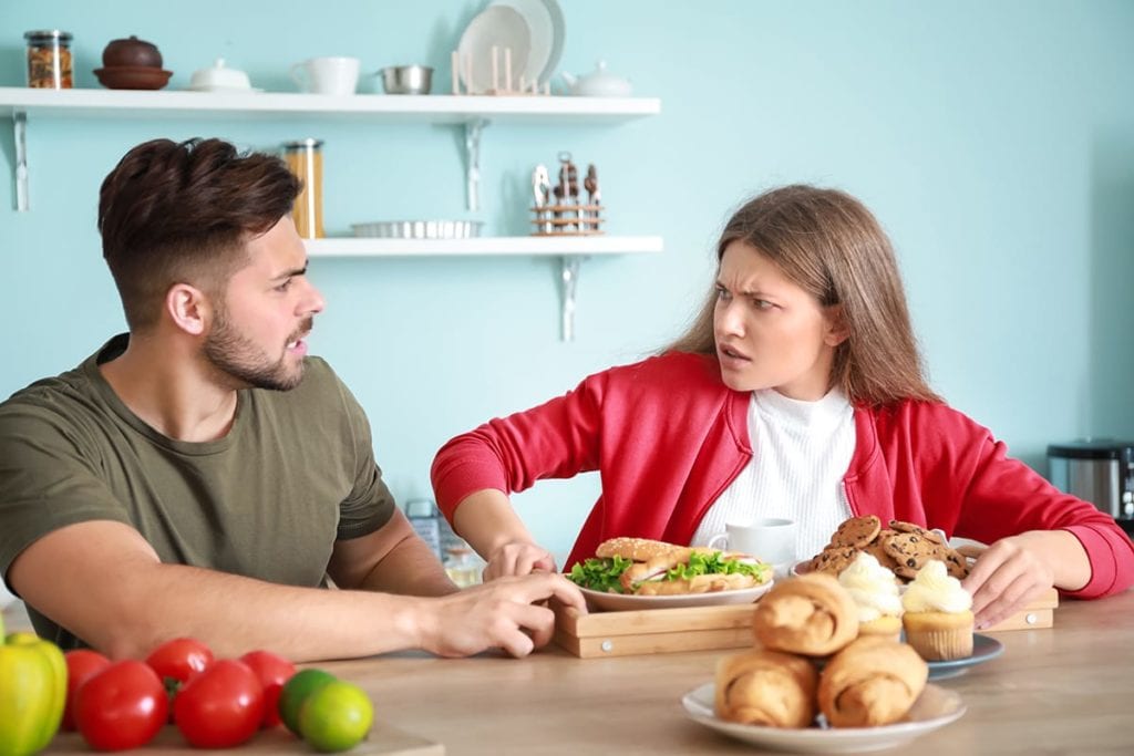 A couple argues over whether one of them is a food addict