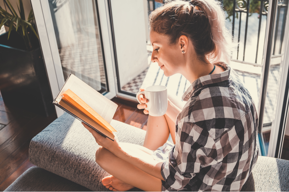 Woman reading to better mental health